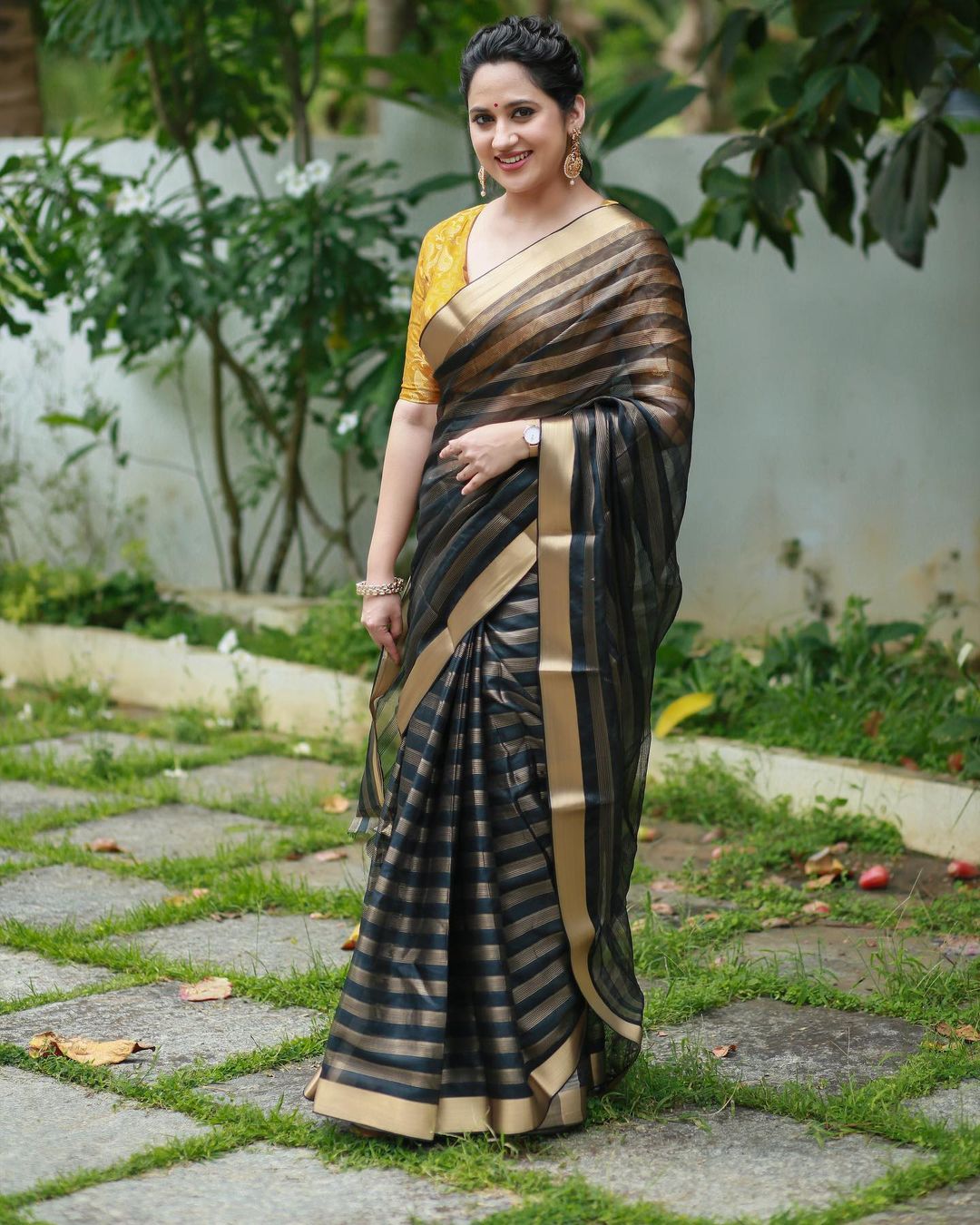 Malayalam Actress Miya George Stills in Black Saree Yellow Blouse